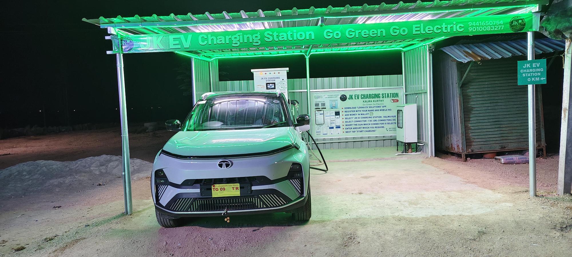 A JK EV charging station at night — working, but unmarked and hard to judge from the road